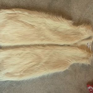 This faux fur vest is one I have rarely seen. I received many compliments.